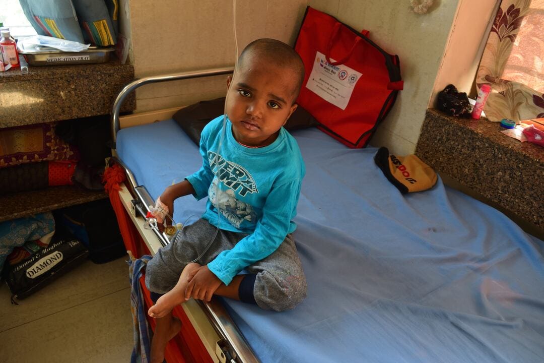 Child suffering from cancer in agony